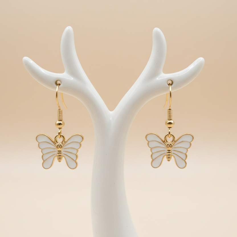 Butterfly earrings on light background