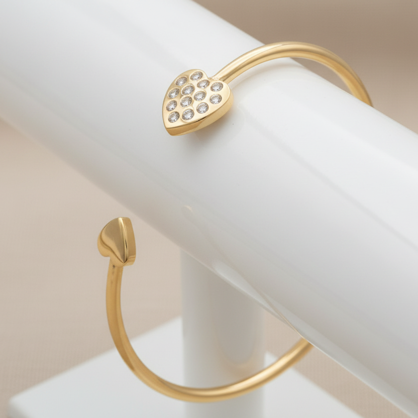 Gold heart cuff bracelet on a holder